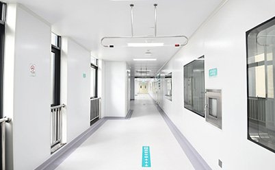 Hospital corridor scene image from the company homepage case material. Project attribution follows the official site text; the image itself carries no project name.